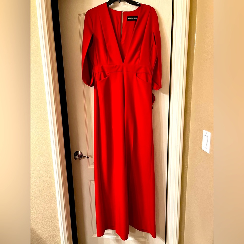 Size M NY&C red cape jumpsuit. Pockets and a side zipper. NWT.
